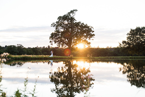 Coworth Park weddings lake couple credit Fiona Kelly